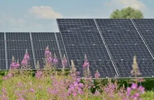 Solar panel cell on dramatic sunset sky background,clean Alternative power energy concept.